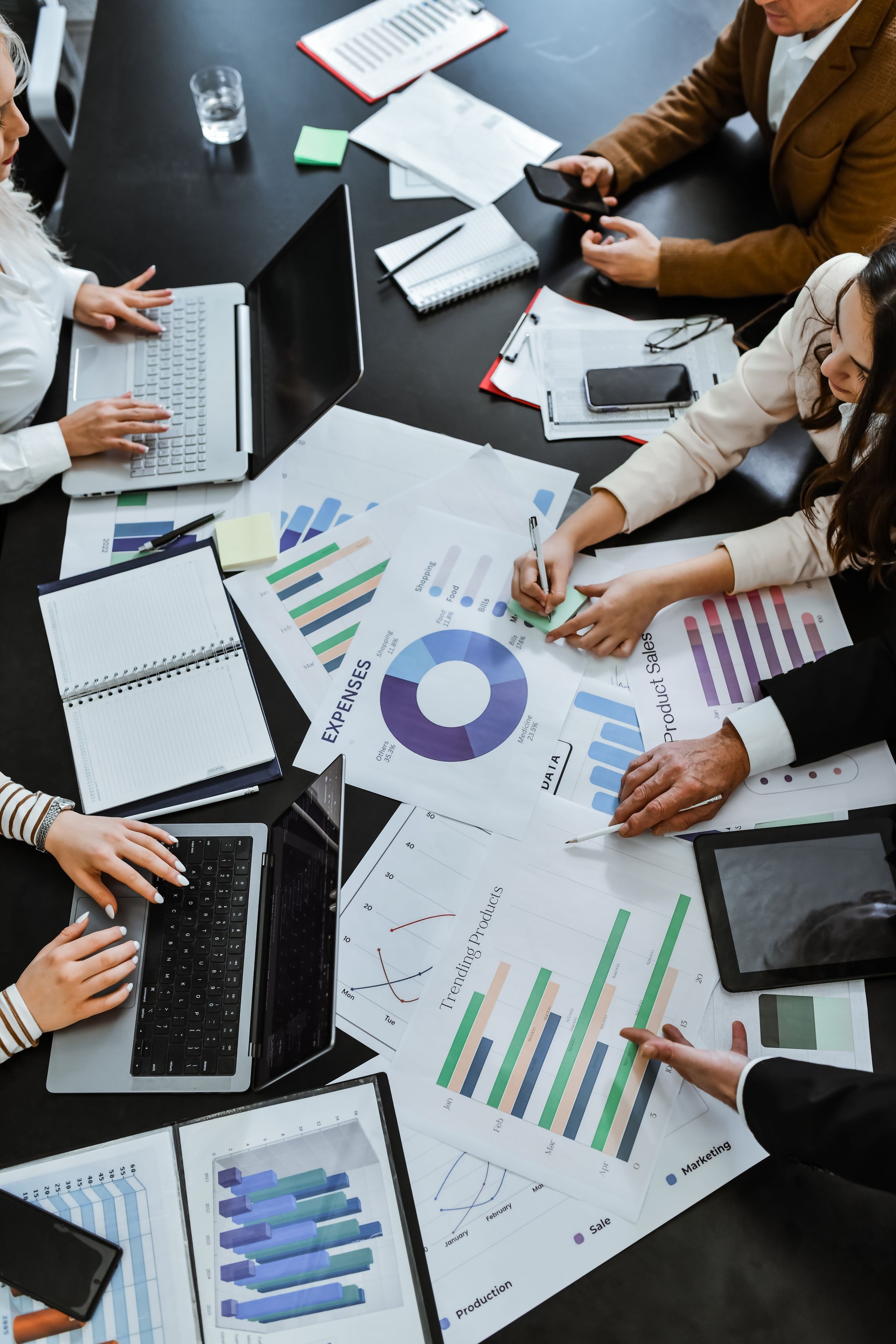 Conference Table Covered in Documents and Paperwork While Employees Are Having Busy Work Day